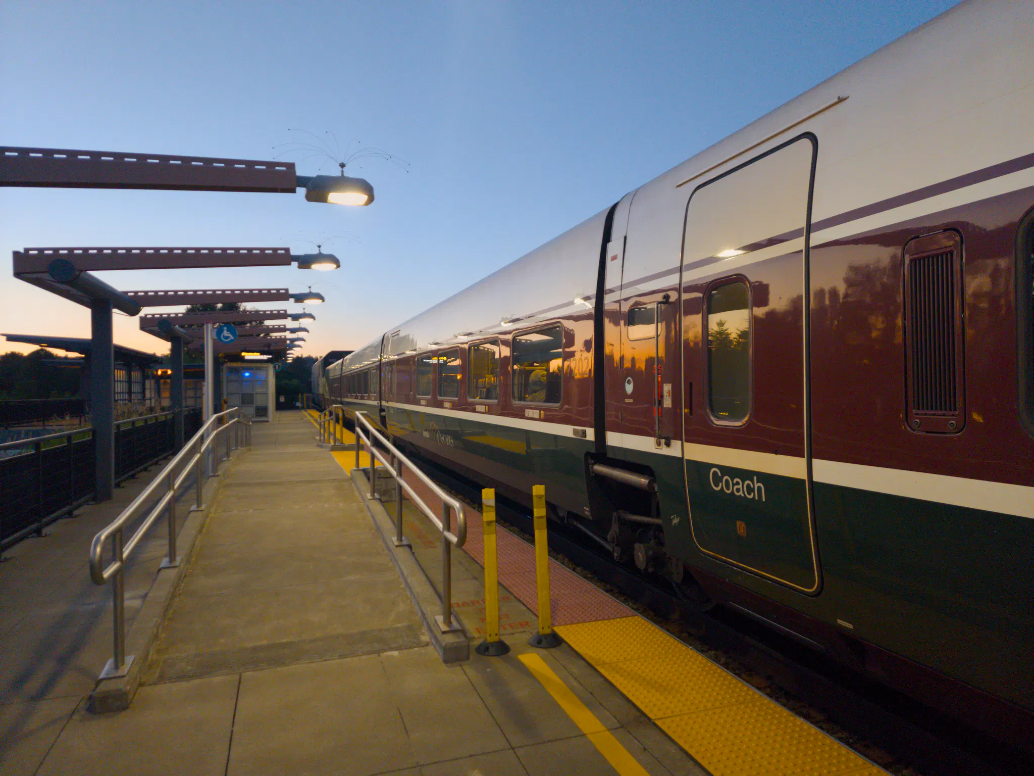 One of the Talgo trainsets for Amtrak Cascades, stopped at Tukwila Station. It's a Talgo Series 8 trainset. The bottom of the livery is green, with a white pinstripe, and the top two-thirds is a dark red or brown